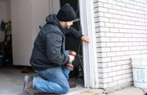 716 technician fixing garage door