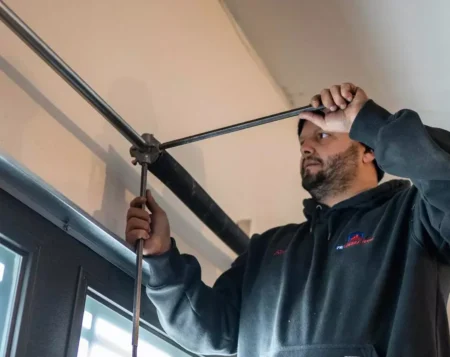 716 technician doing a tune up on local home with a broken garage door 