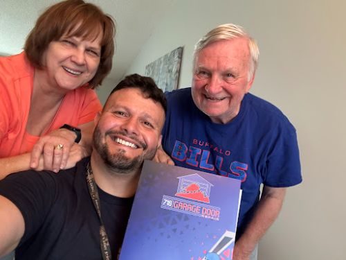 716 Garage Door technician with a happy customer in Buffalo