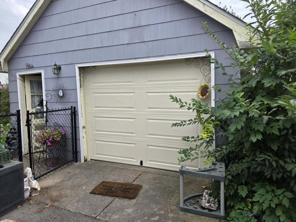 new almond colored traditional garage door