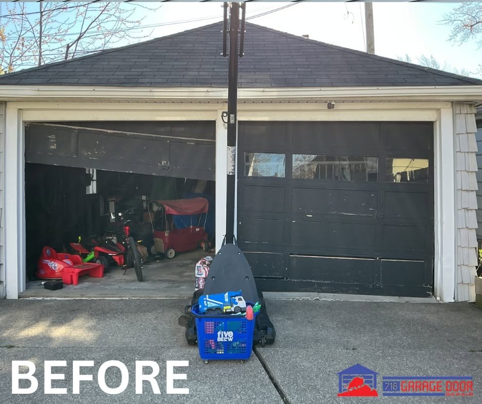 Worn garage doors with the left door crooked and partially open.